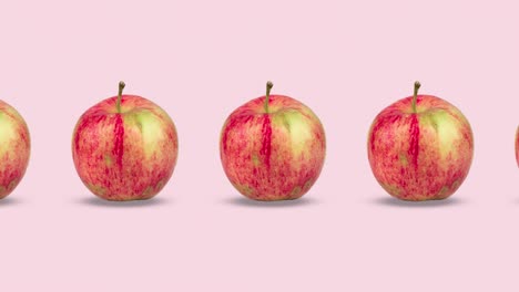 muchas manzanas rojas frescas animadas en un fondo rosa o pastel. bucle sin costuras de comida 3d realista. arte de diseño de movimiento minimalista con frutas