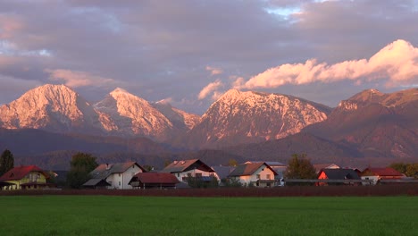 time lapse shot of houses and chalets in the julian alps in slovenia