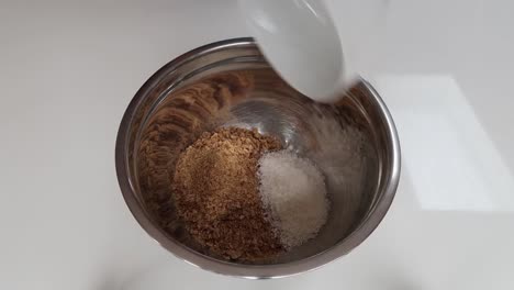 putting dry slice ingredients into a bowl