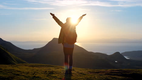 woman on summit at sunset