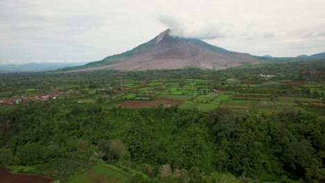 aerial drone shot of active vulcano sinabung in indonesia