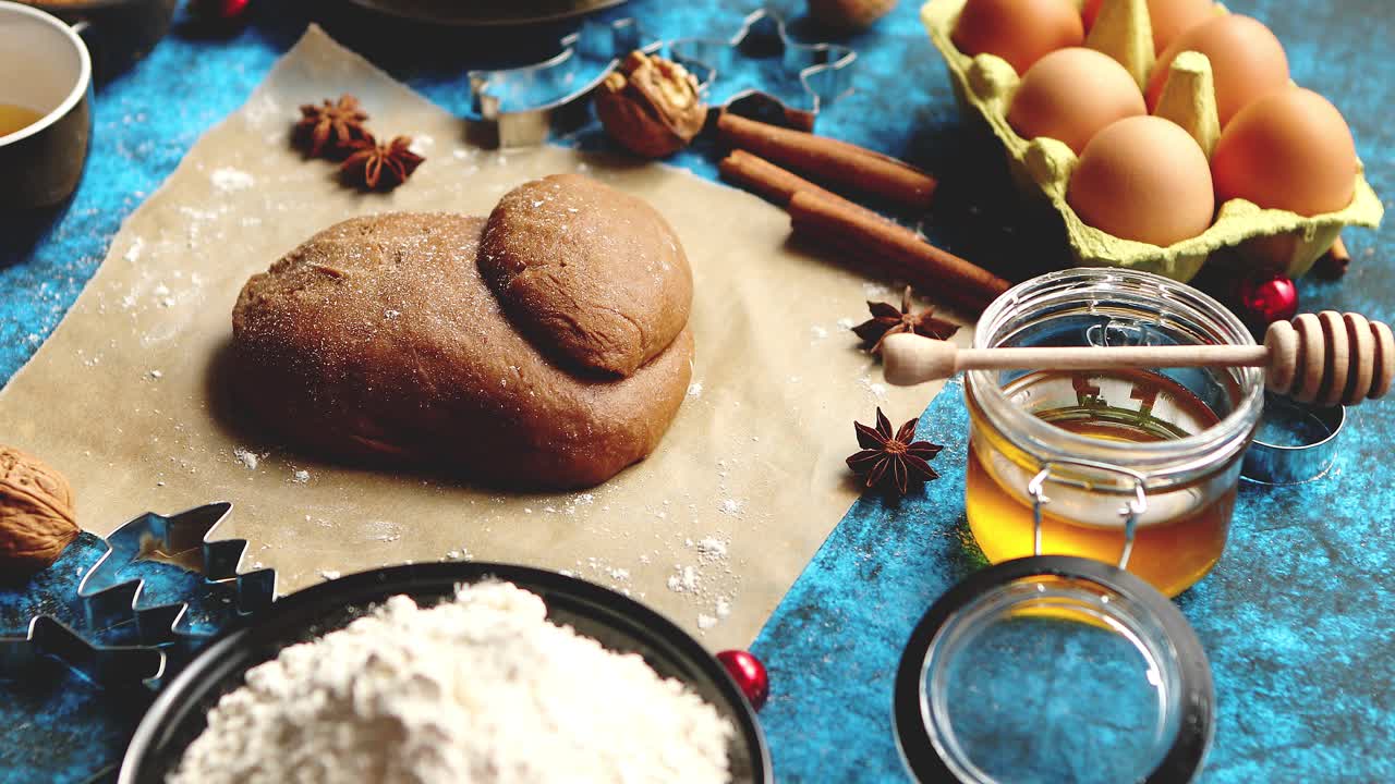 Gingerbread dough placed among various ingredients  Christmas baking concept