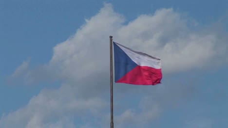 the flag of the czech republic flies in the breeze