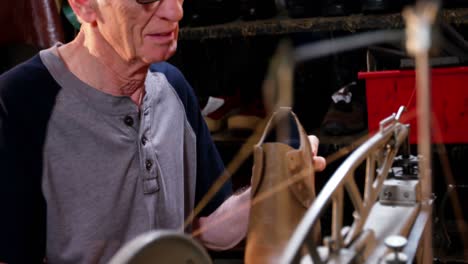 shoemaker using sewing machine