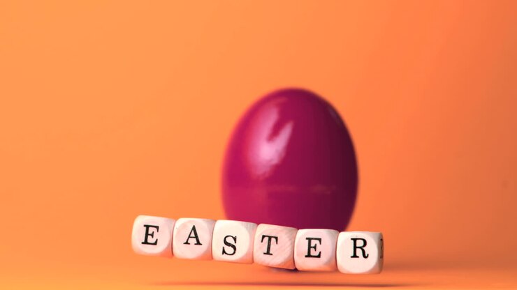 Dice spelling out easter falling against orange background