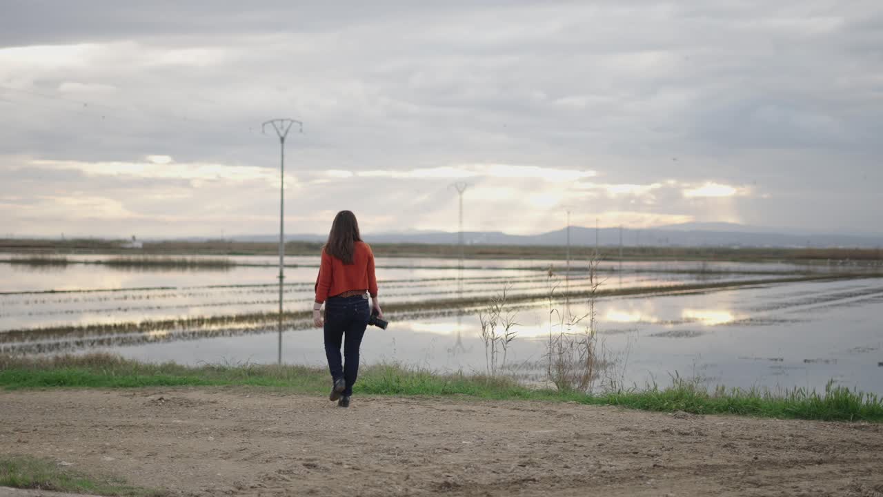 Woman Photographer in a Rice Paddy Field
