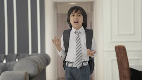 angry indian school boy shouting on someone