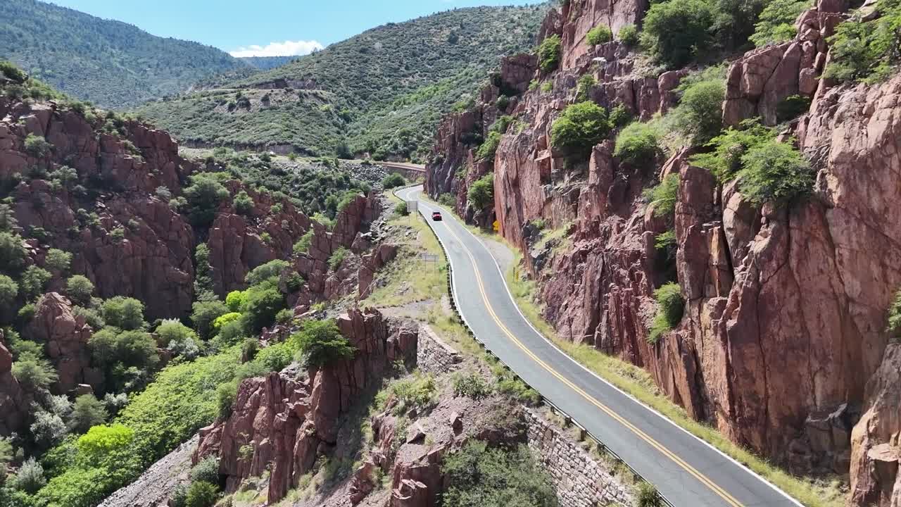 Aerial Views of Jeep Driving on a mountain Road Near Jerome, Arizona. Highway 89A