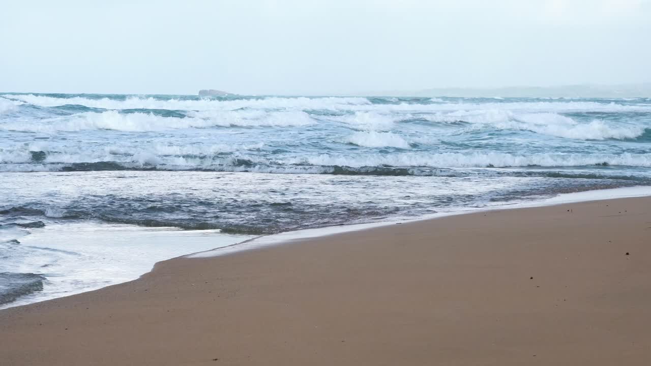 Playa Chiquita Beach in Panama Central America with sandy shore and rough waves, Handheld low shot