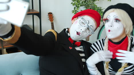 mime couple taking a selfie