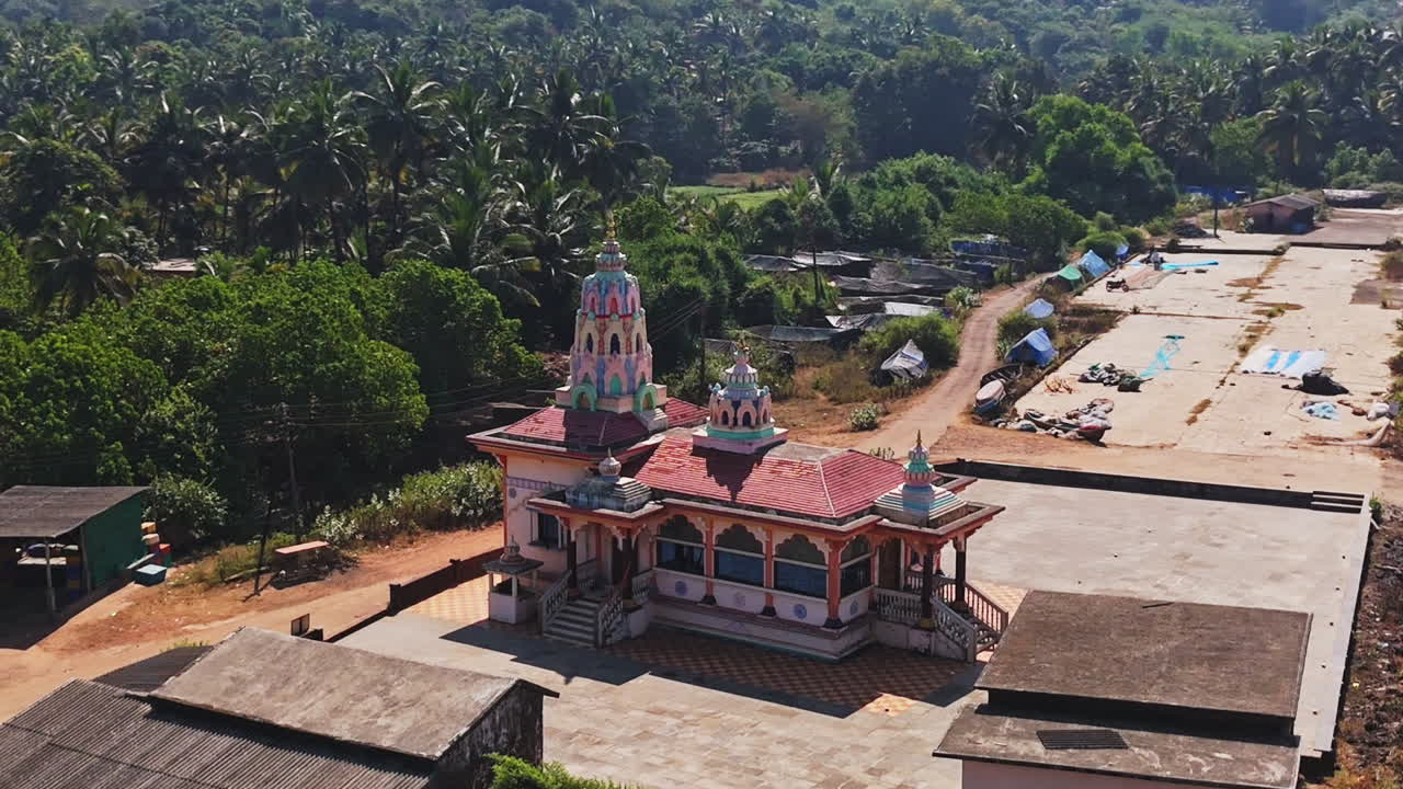 Aerial view around a Hanuman Mandir Hindu temple, sunny day in Guhagar, India