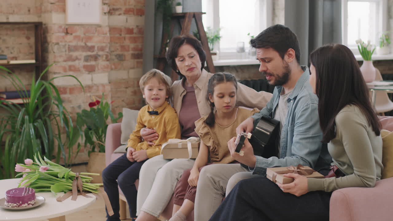 Family celebration with guitar and gifts