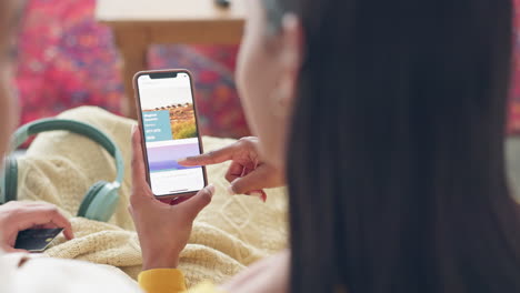 Couple,-phone-and-travel-app-in-home-for-holiday