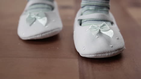 baby wearing booties first steps