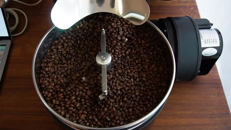 slow motion shot of coffee artisan roasting process