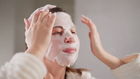 woman using a face mask for a relaxing skin care routine