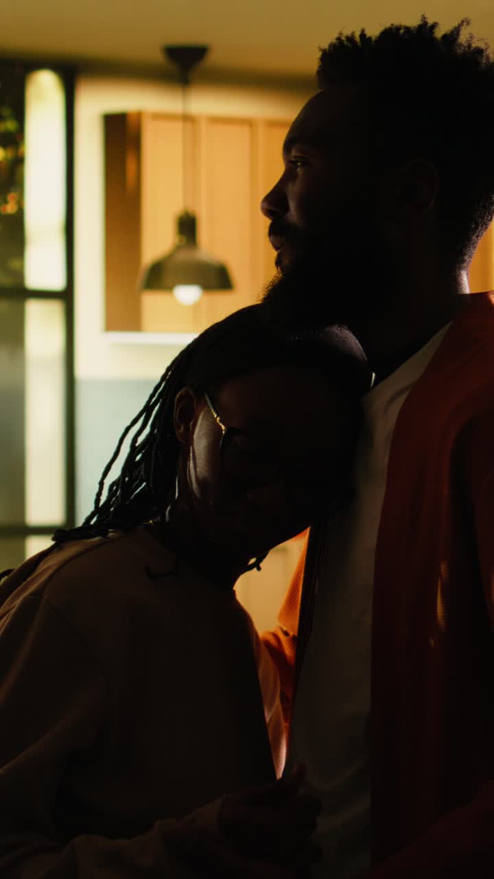 Vertical Video Happy black couple after argument sharing intimacy and comfort indoors