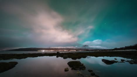 aurora lights over skibotn in a stunning timelapse of a serene arctic landscape