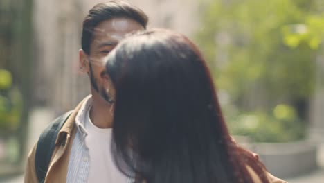 close up of muslim couple on date meeting on city street