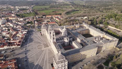 aerial circling shot of royal palace, revealing mafra cityscape