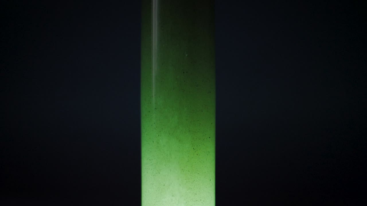 alien tube with green liquid spaceship fuel in slow motion