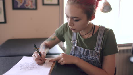tattoo artist sketching design