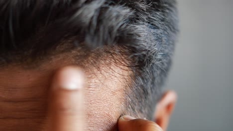 close-up of a man's head and hair