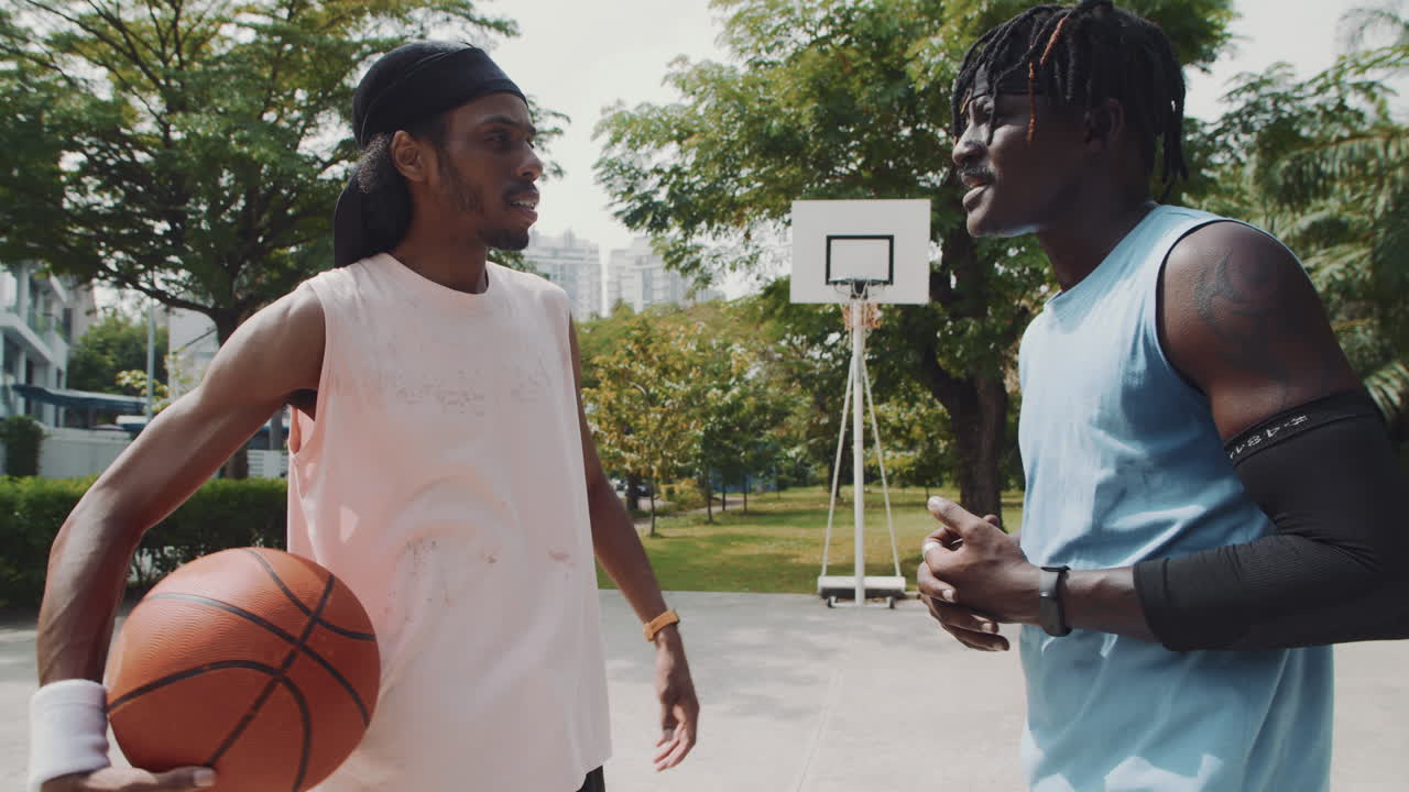 Male Basketball Players Setting Smartwatch before Game