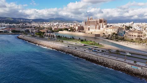 cathedral de mallorca overlooking the sea with city backdrop, sunny day, aerial view