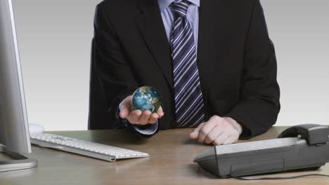 businessman with a rotary globe in his hand