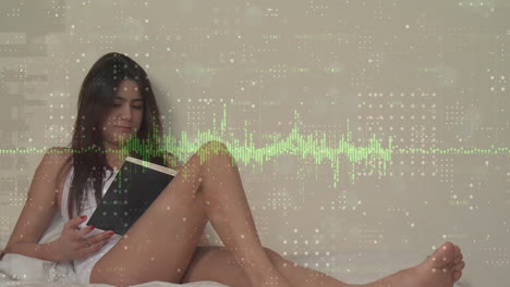 animación de gráficos y puntos sobre una hermosa mujer caucásica leyendo un libro y sentada en la cama en casa