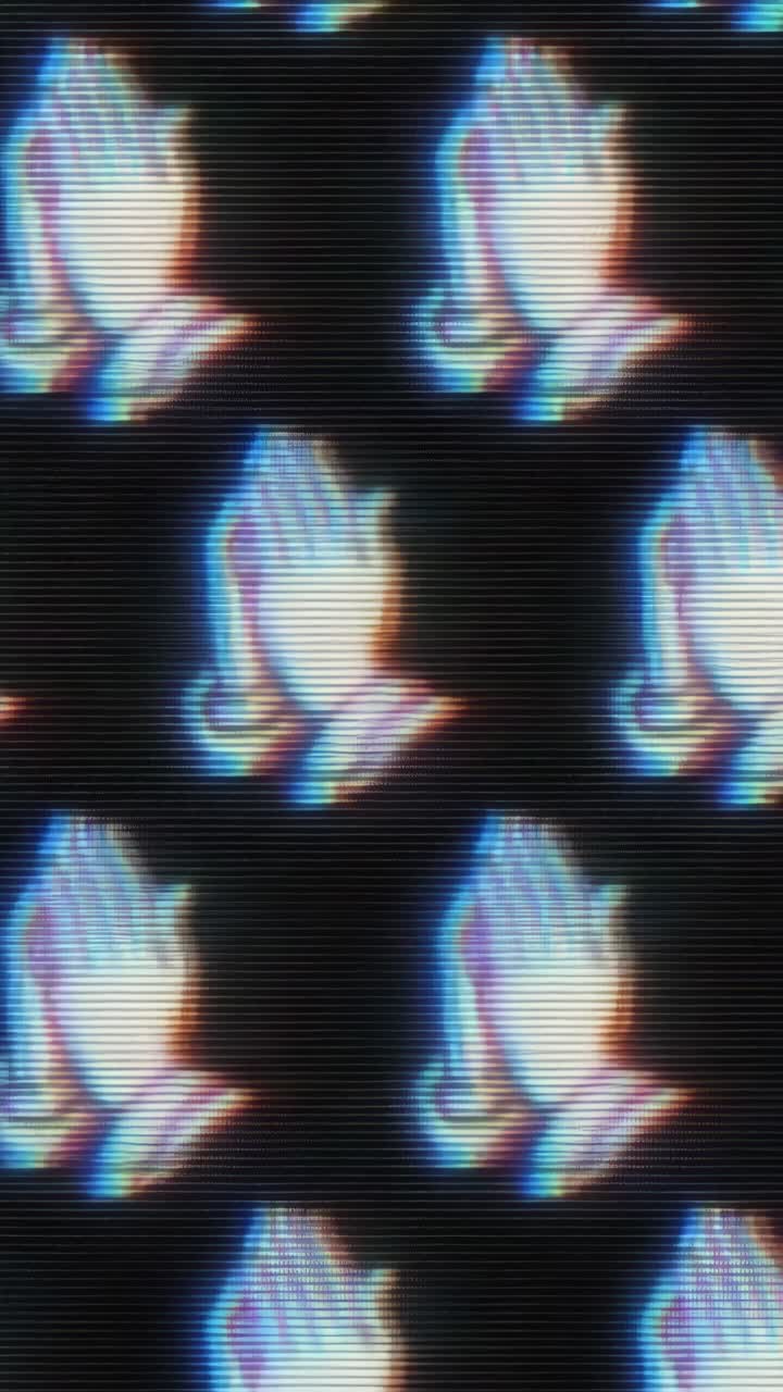 Retro video style image of praying hands with a glitch effect