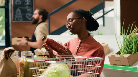 Organic-supermarket-client-checks-sauces