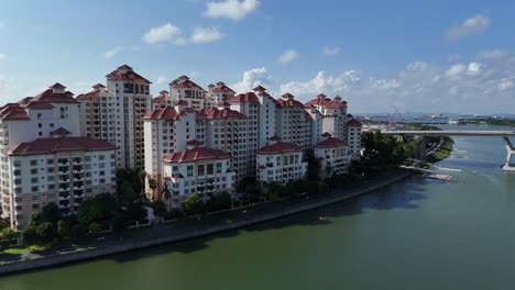 Drone aerial view of singapore city state tall buildings skyscrapers skyline during the day marina bay sands hotel gardens by the bay