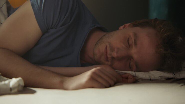Man Sleeping in Bed