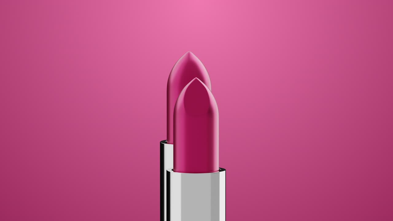 Rossetto color rosa che ruota su sfondo rosa.