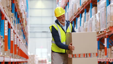 Warehouse-worker-suffering-from-back-pain-while-working