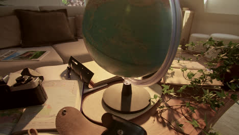 globe, maps, and travel essentials on a table