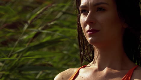 Slow-motion-close-up-of-brunette-model-girl-outdoor-in-sunshine-during-windy-day