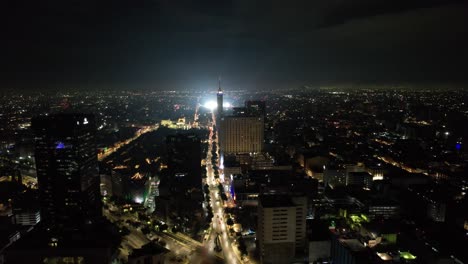 elevation drone shot of madero avenue and zocalo ilumninated for independence day celebration at mexico city