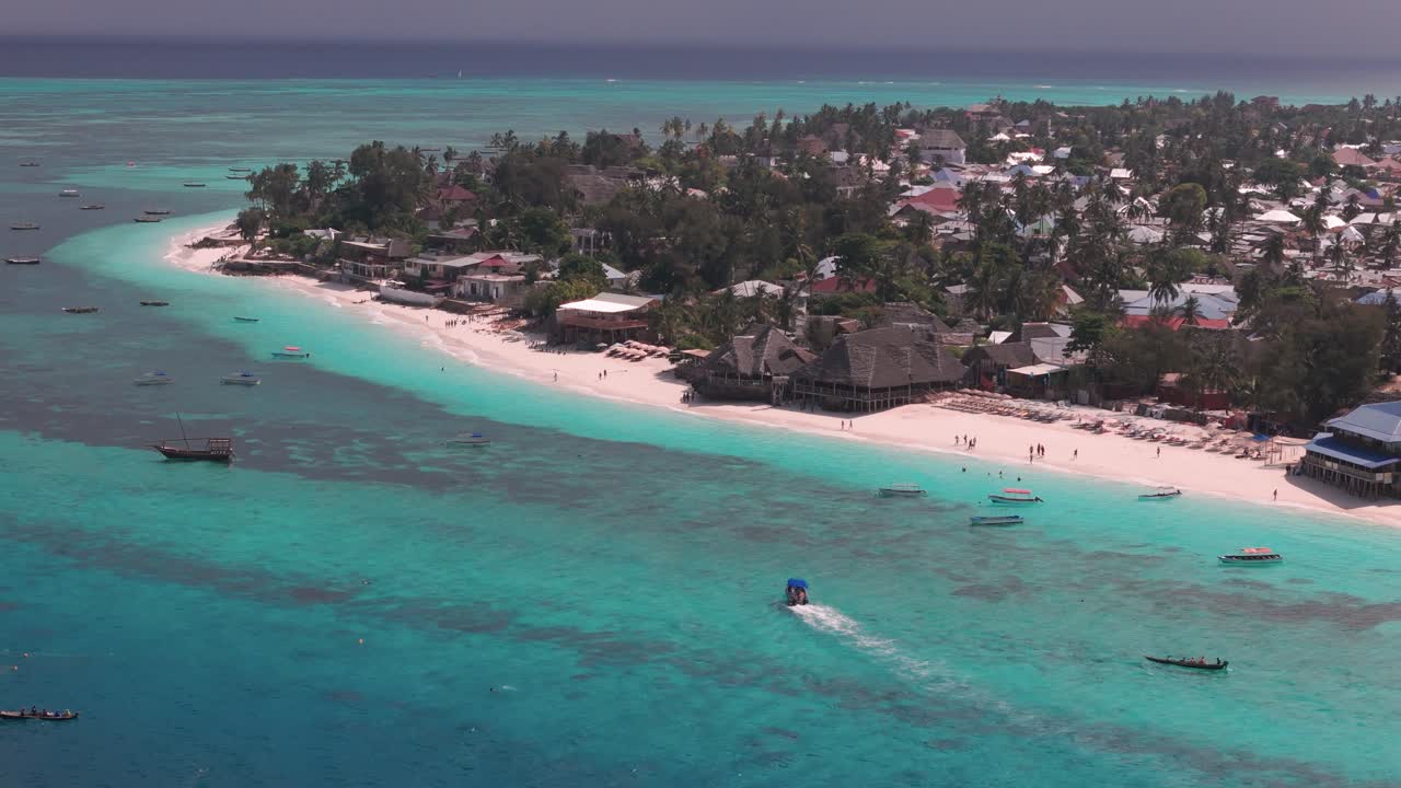Vacationers At Nungwi Beach Luxury Resort Hotel In Nungwi, Zanzibar, Tanzania. Aerial Drone Shot