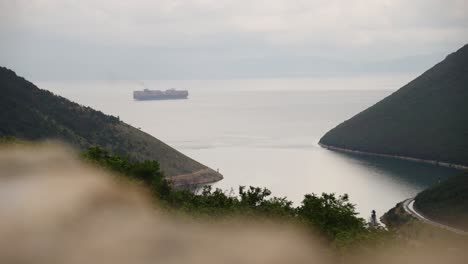 mist on cargo ship at sea in distance