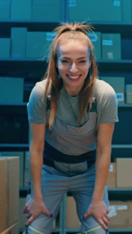 happy woman worker in warehouse