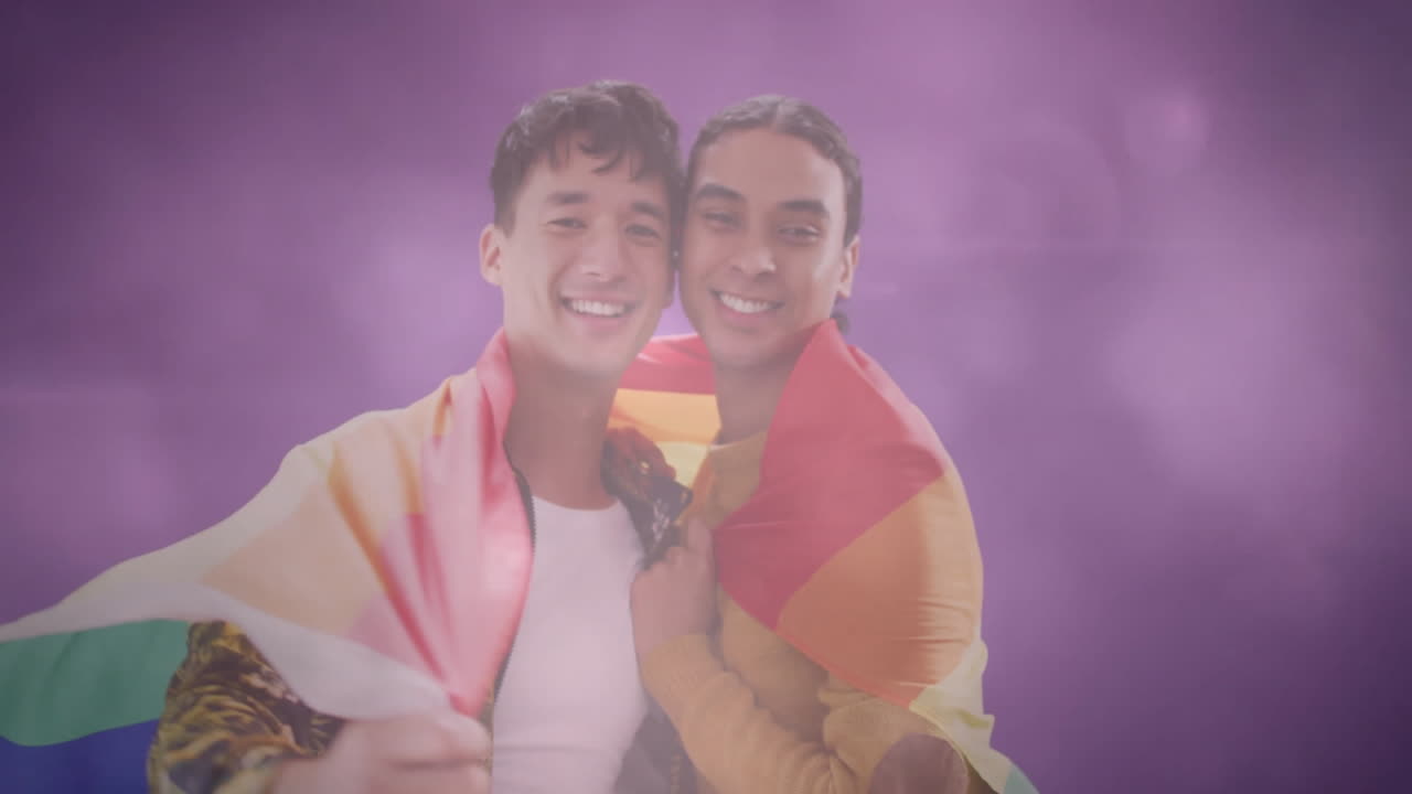couple marketing pride hugging under rainbow flag in studio with floating icons and lens flares
