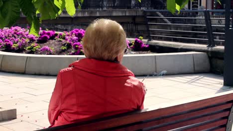 senior woman smoking park