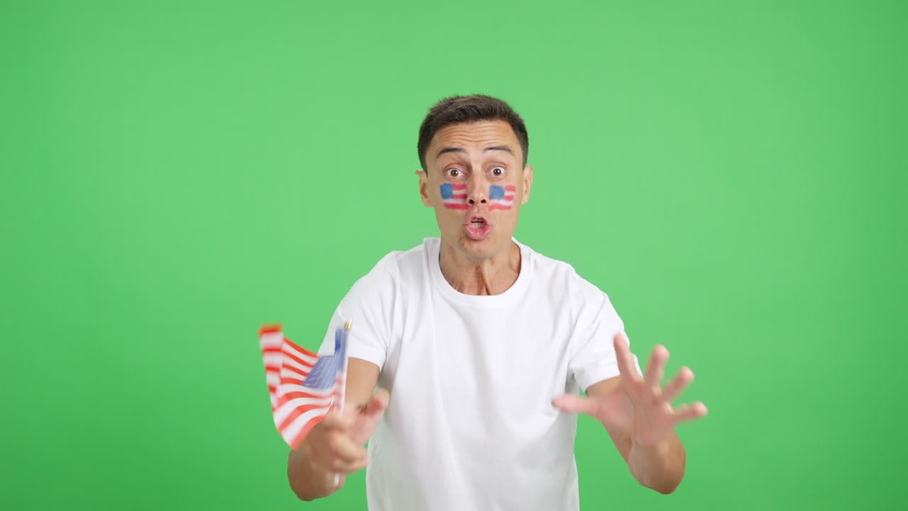 Passionate USA supporter screaming and waving a national flag