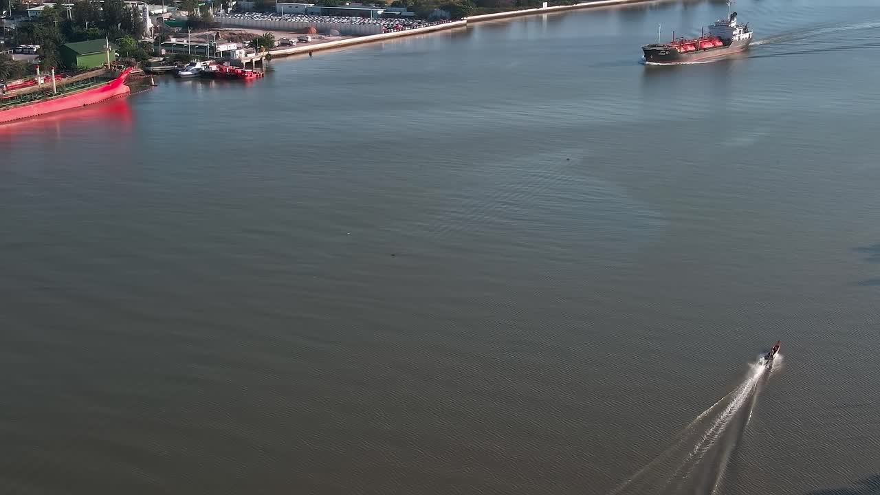 View of a boat cruising on the water in Bangkok during the day