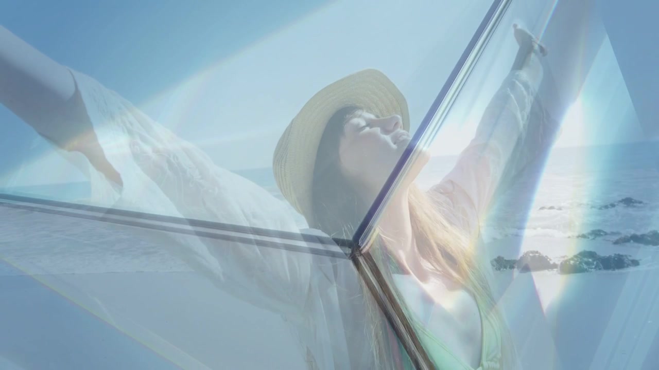 Vertical video: Basking woman wearing sunhat and yellow bikini on beach, prism refracting light