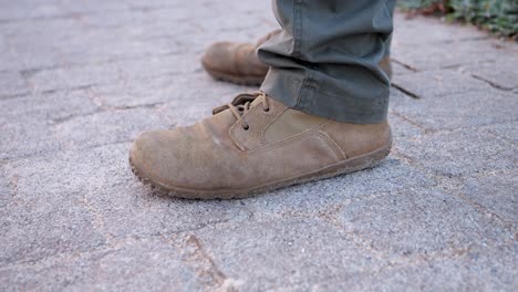 Video-shot-of-a-person's-brown-shoes