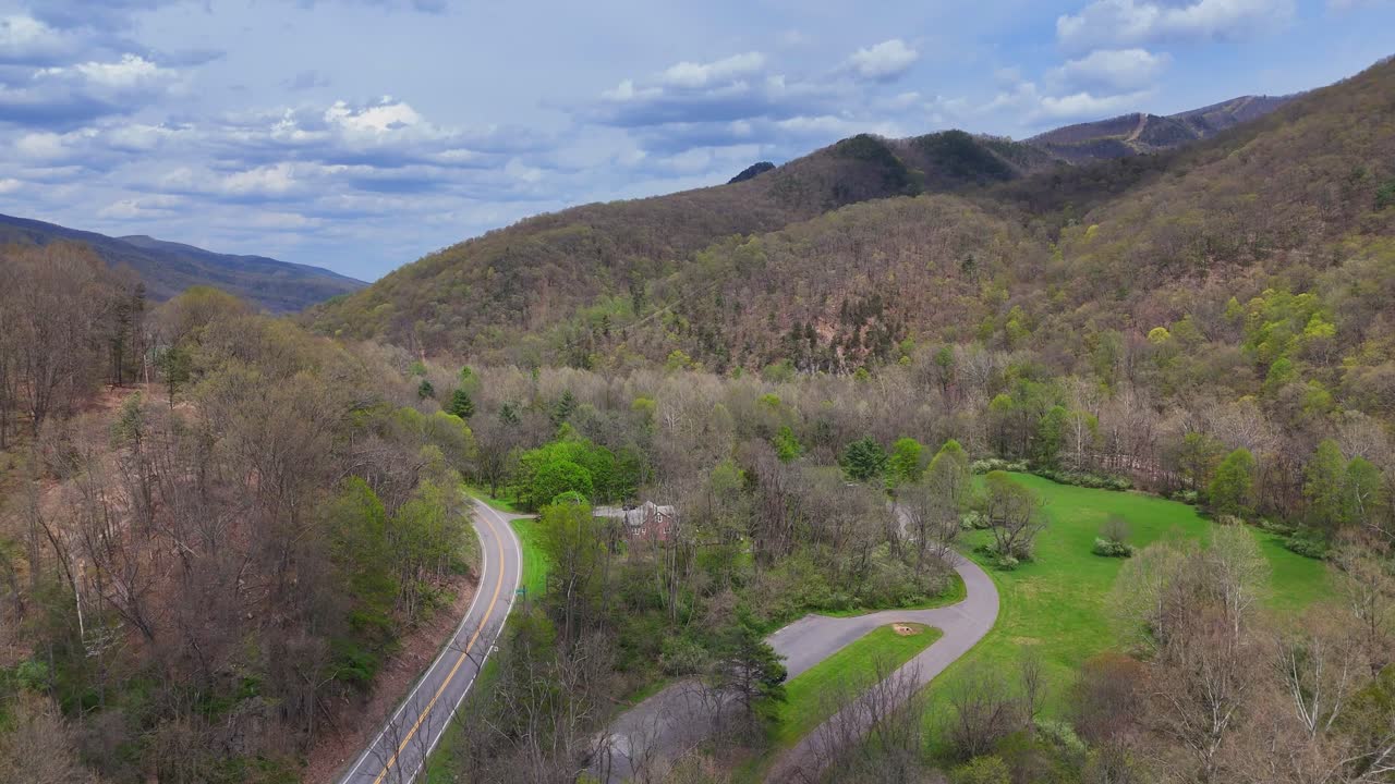 Scenic valley road leading toward forested Seneca Rocks mountain range, West Virginia, USA